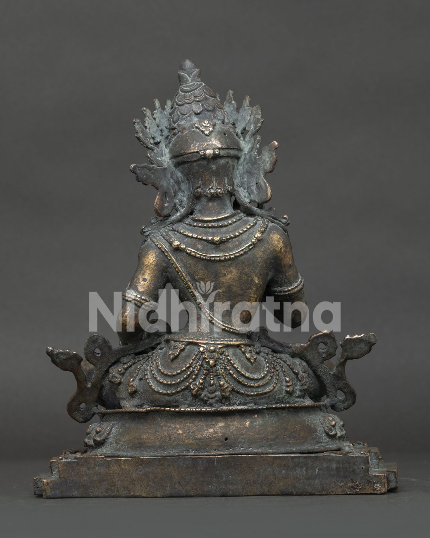 Back view of handmade bronze Vajrasattva statue from Nepal highlighting the rich antique patina finish.