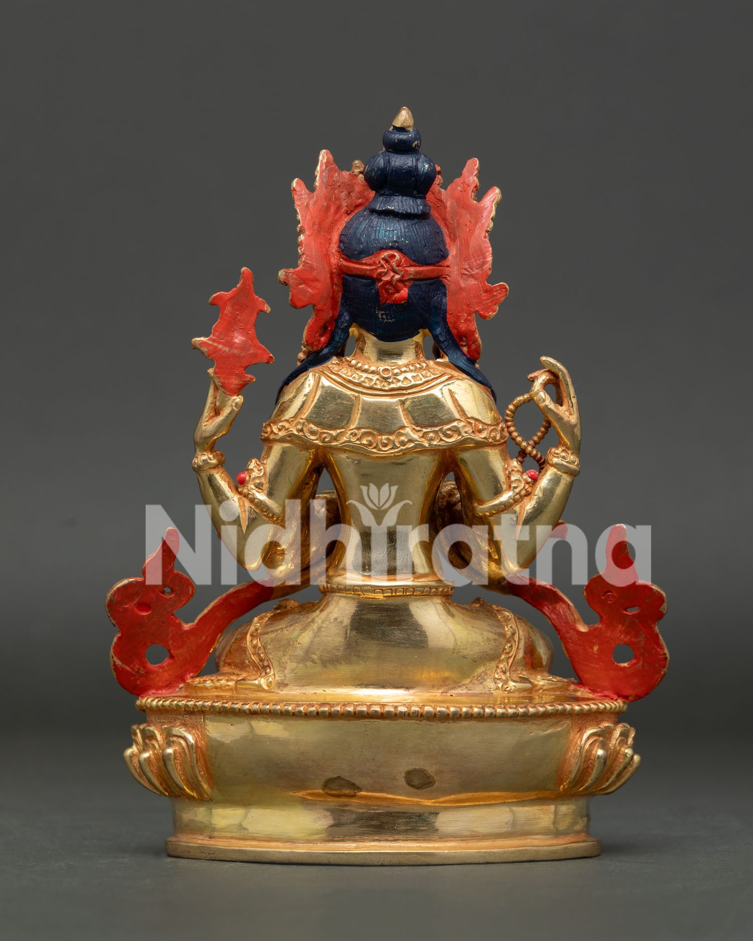 Back view of handmade Chenrezig Buddhist statue, created using the lost wax casting method