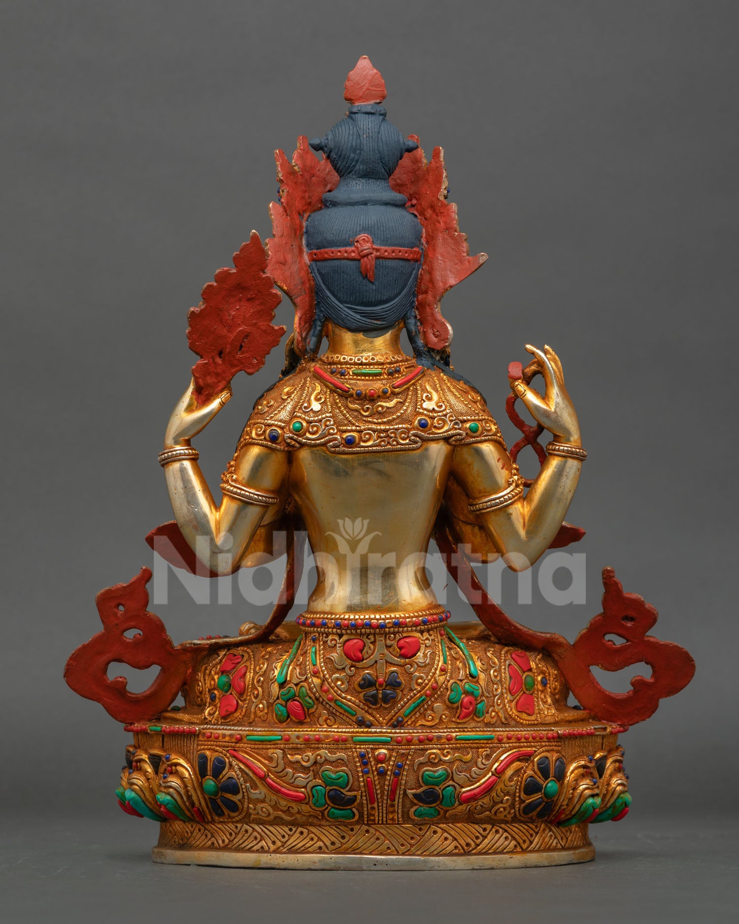 Back view of a handmade Chenrezig statue from Patan, Nepal, showcasing intricate Himalayan craftsmanship and sacred Buddhist artistry