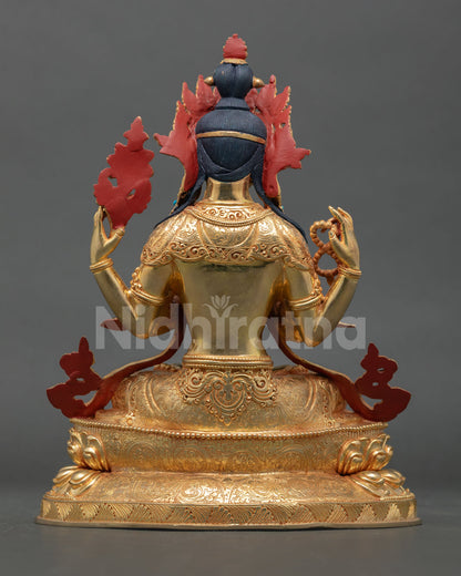 Back view of handmade Chenrezig statue from Patan Nepal with gold gilded copper finish and detailed Himalayan craftsmanship