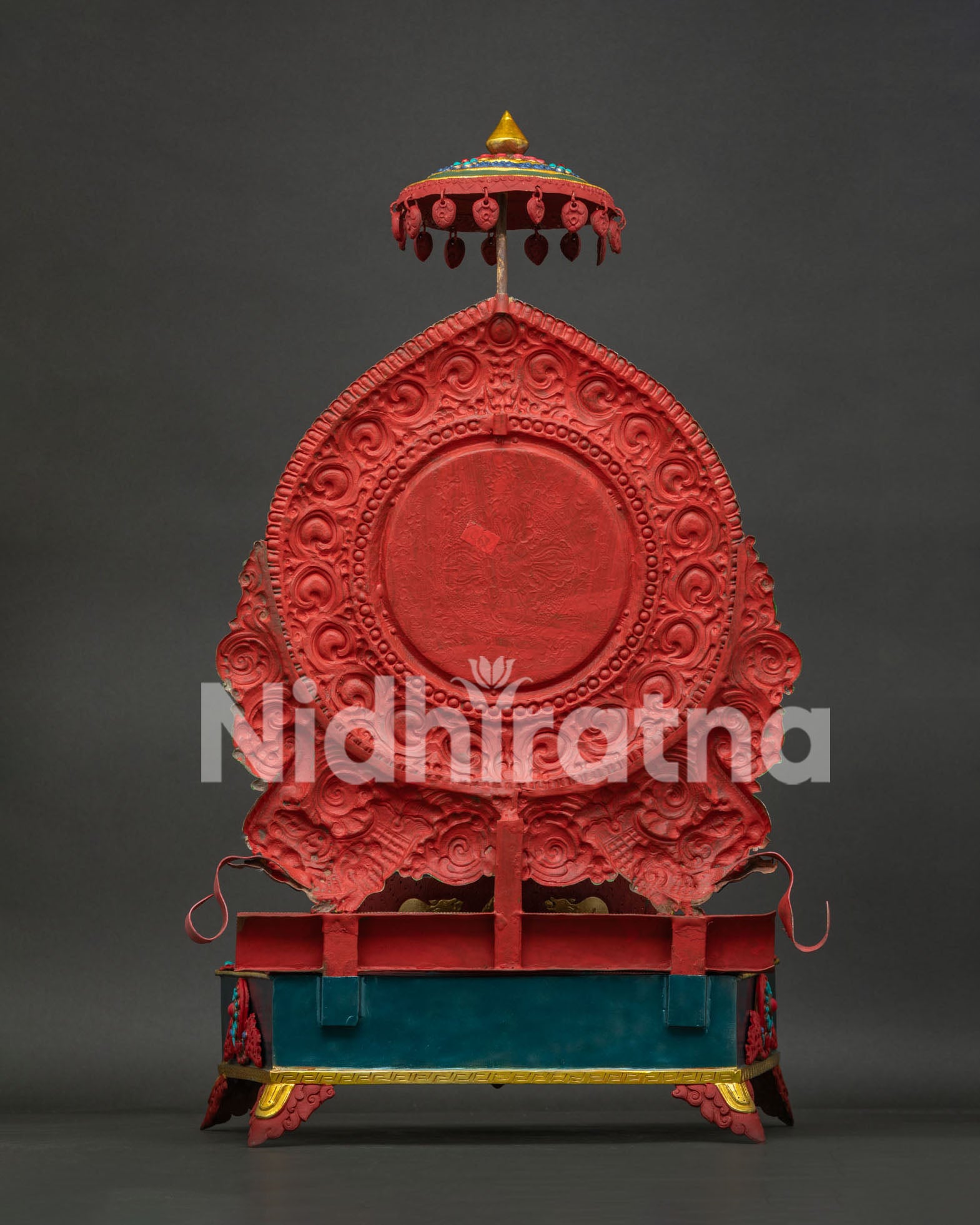 Back view of handmade Ganesh statue showing intricate copper design and craftsmanship