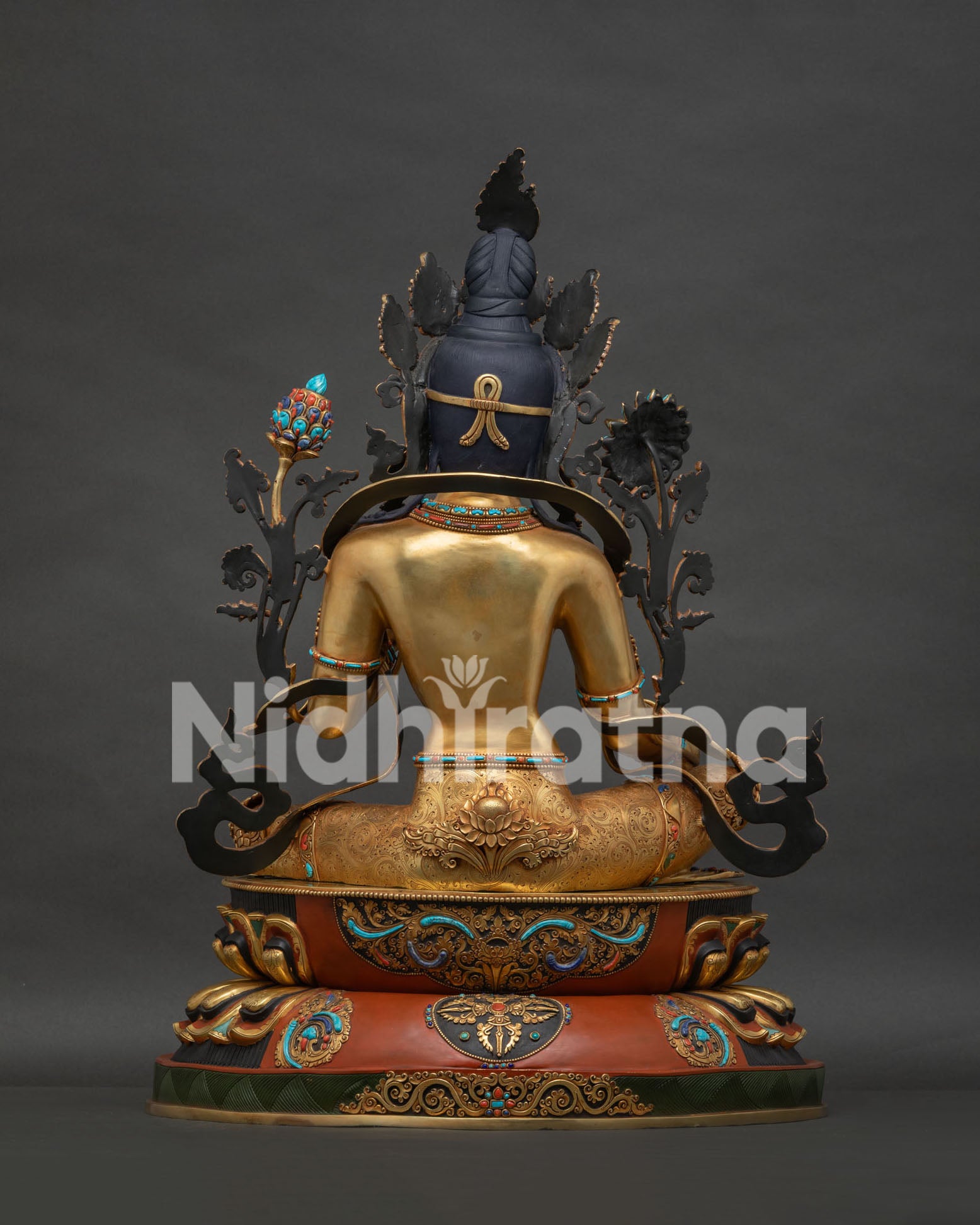 Back view of handmade Green Tara copper statue — intricate Newari scrollwork, Buddhist art Nepal