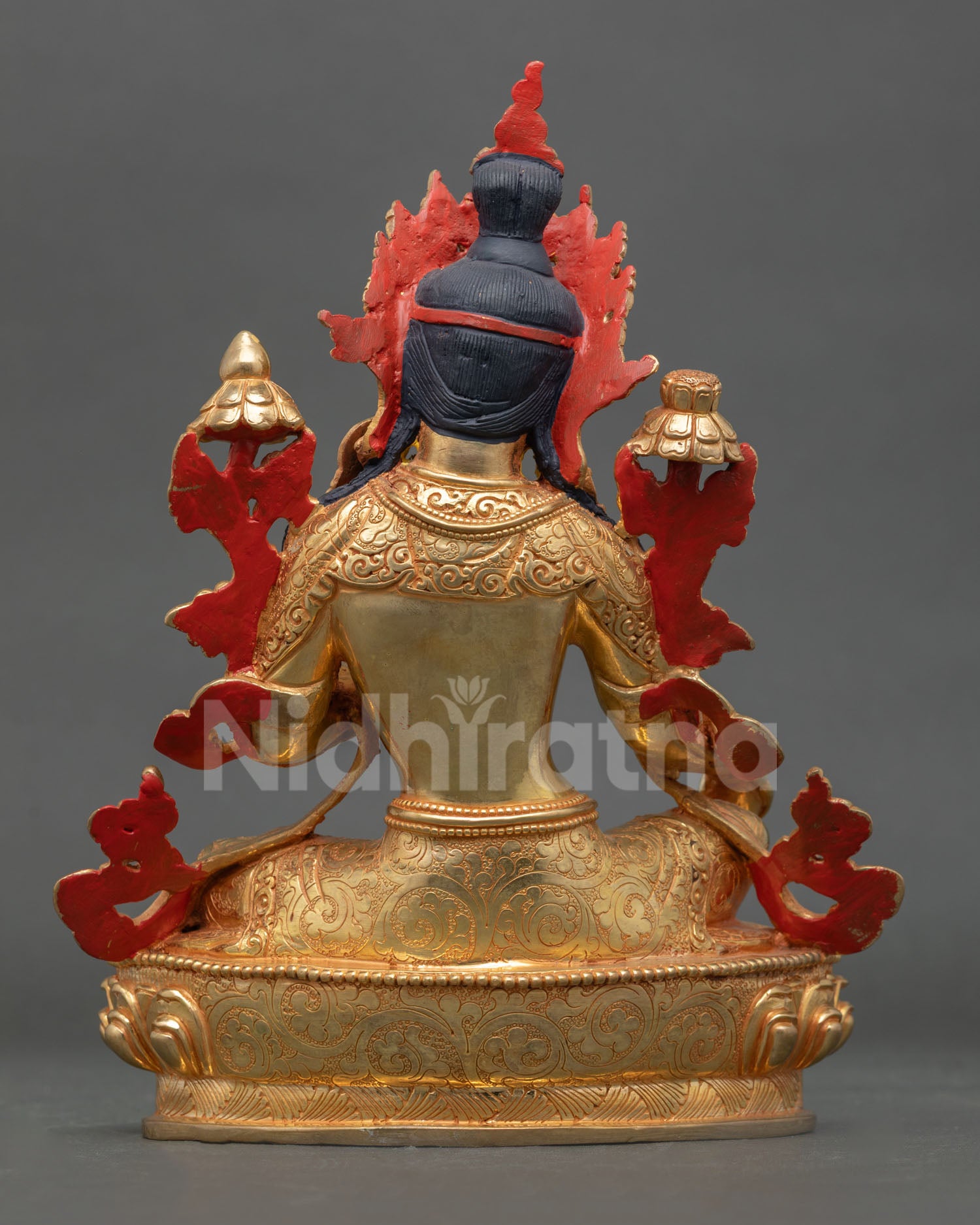 Back view of handmade Green Tara statue from Patan Nepal with gold detailing and sacred Himalayan artistry