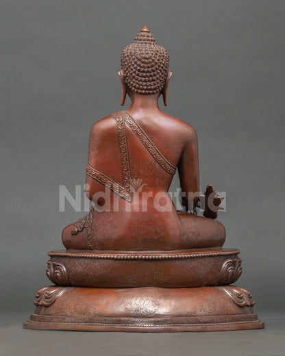 Back view of handmade Medicine Buddha statue with intricate Nepalese craftsmanship details