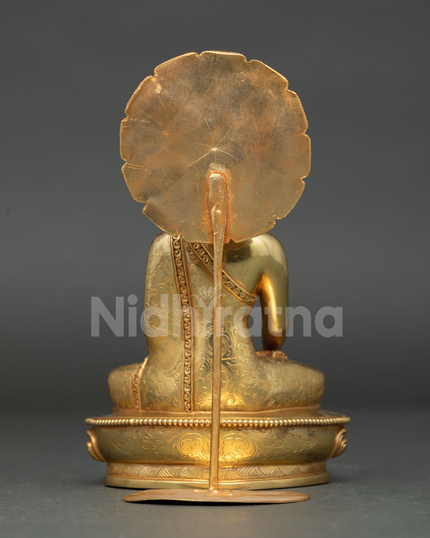 Back view of handmade Mitrugpa statue showing decorated halo with sacred detail