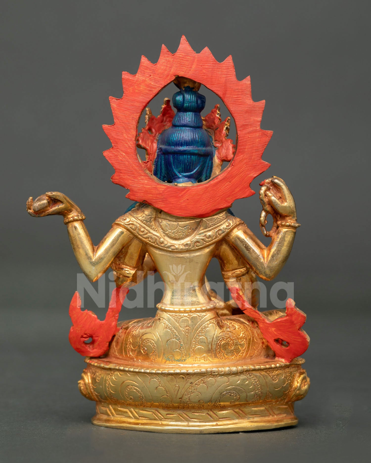 Back view of handmade Saraswati statue from Nepal copper craft with gold detailing and Newari artisan workmanship