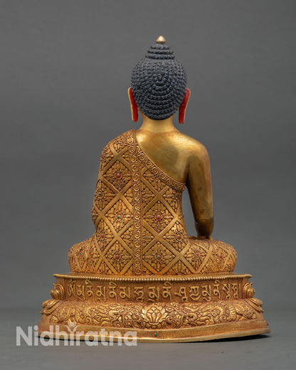 Back view of handmade Shakyamuni Buddha statue featuring engraved lotus pedestal tiered petals ornate copper detailing and radiant spiritual Buddhist altar design
