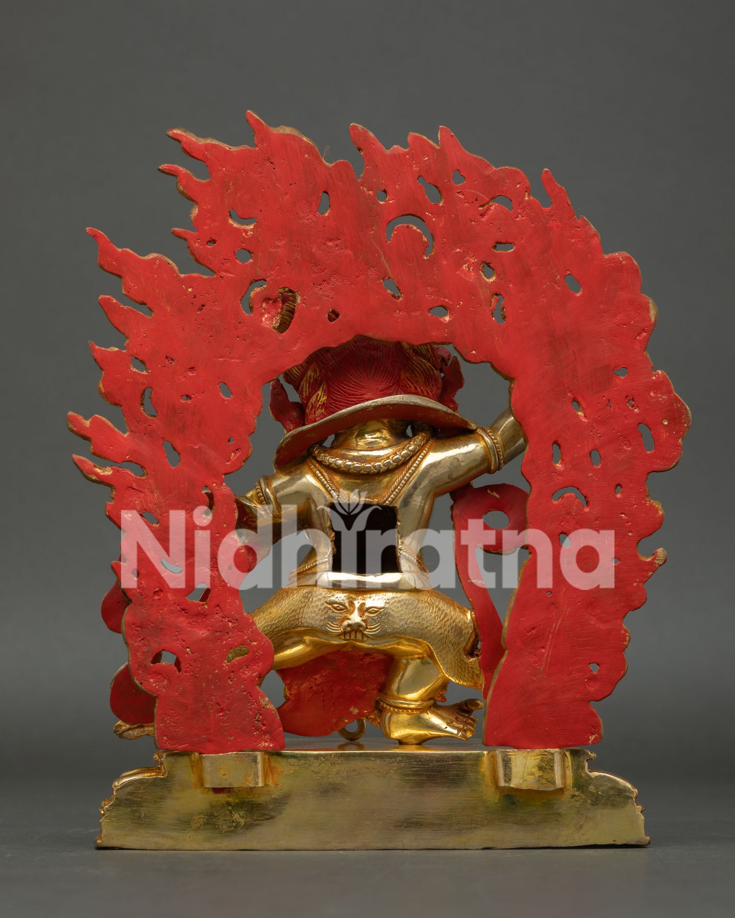 Back view of handmade Vajrapani statue with blazing flame halo and intricate Himalayan craftsmanship
