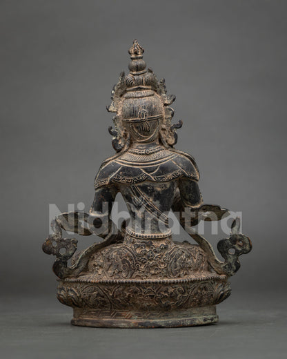 Back view of handmade Vajrasattva statue showing detailed robes, lotus pedestal and copper finish