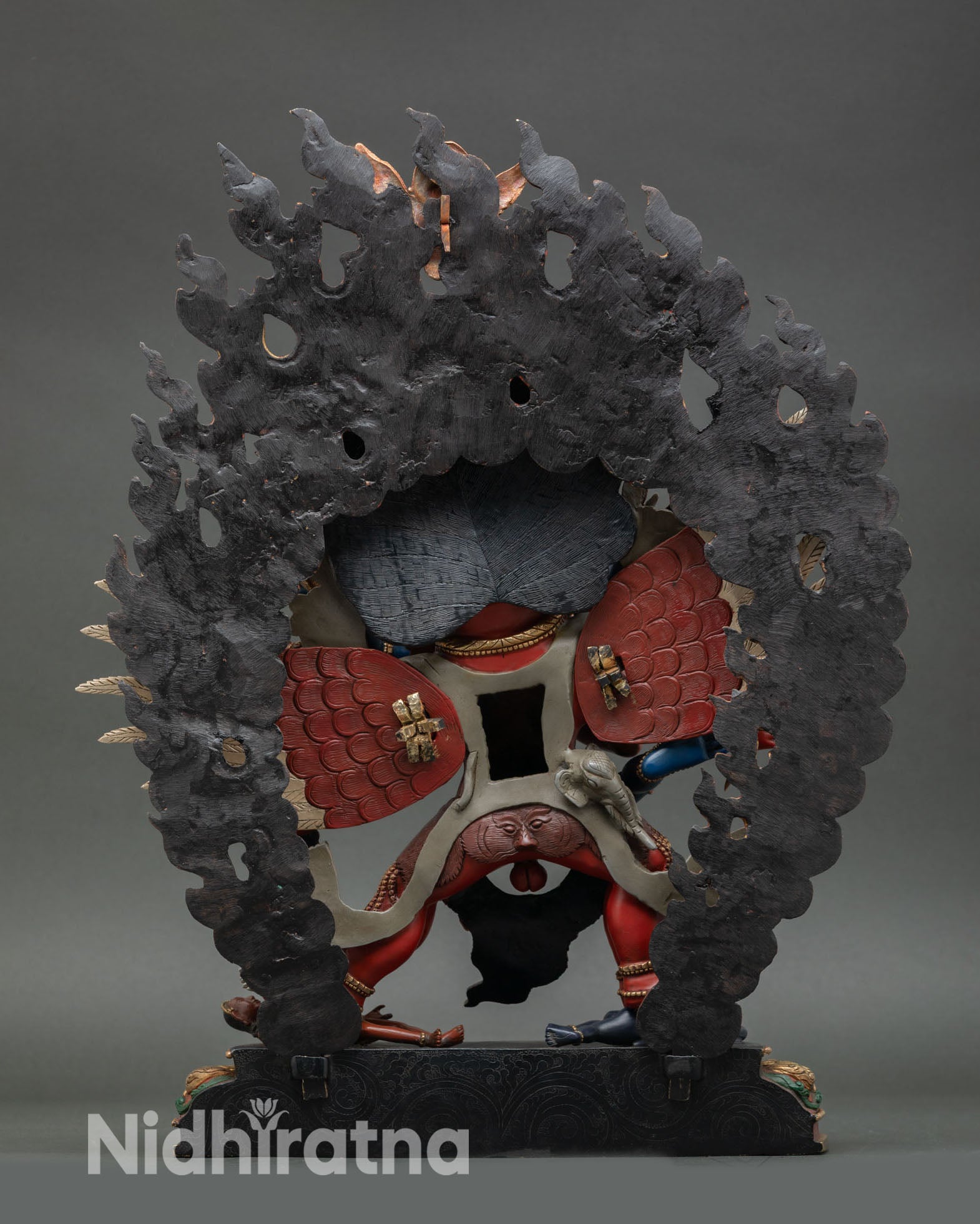back view of hayagriva statue showing halo design, wings and detailed craftsmanship in copper