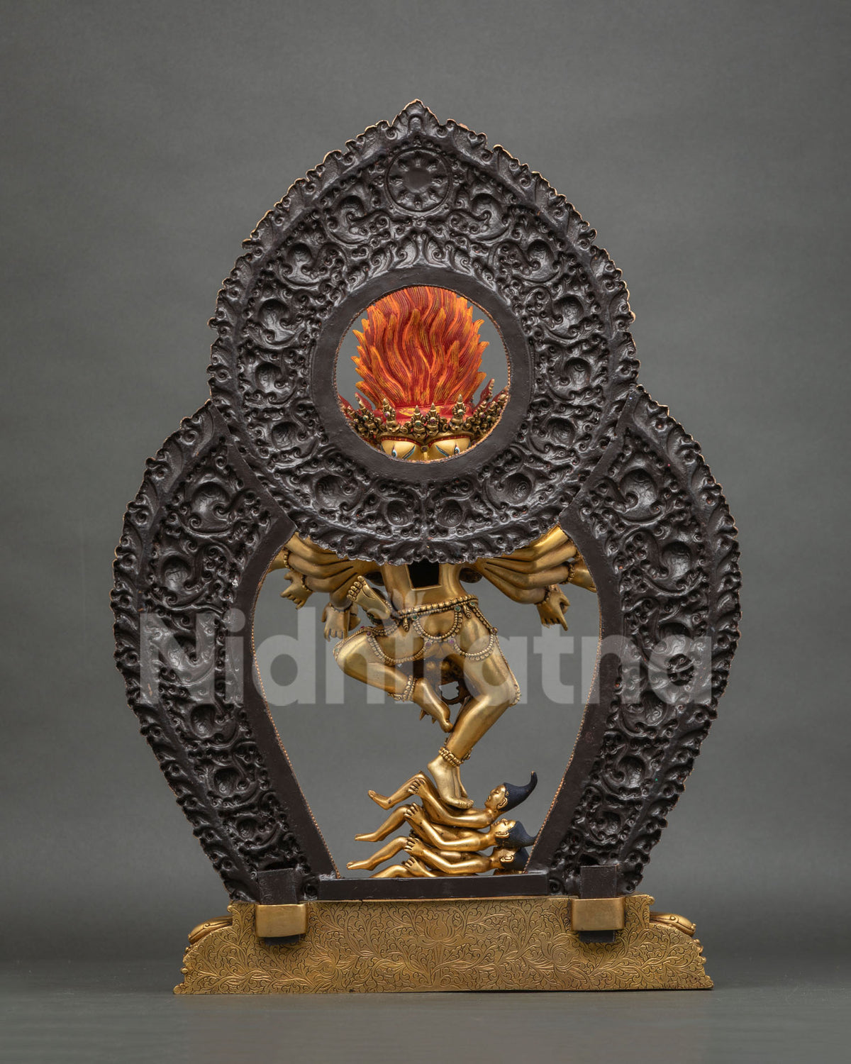 Back view of Hevajra statue with dark patina halo and engraved gold base, Nepali Buddhist art