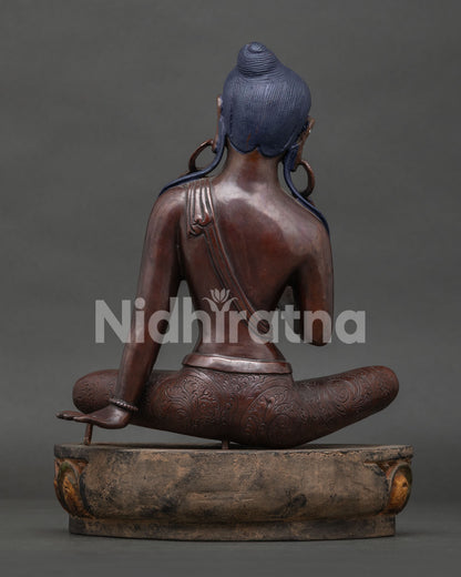 Back view of Jetsun Dolma Green Tara copper statue with flowing hair and lotus base, made in Nepal