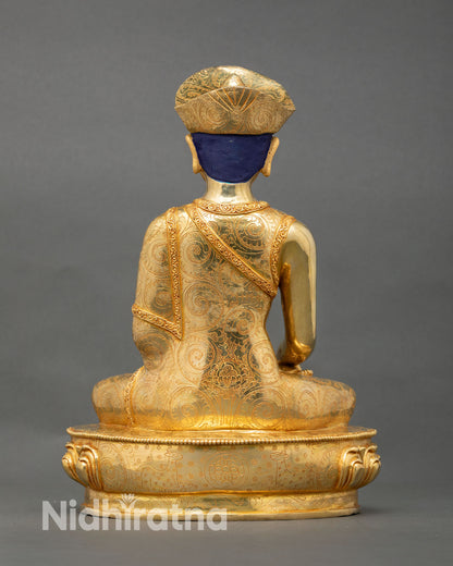 Back view of Jigten Sumgon statue highlighting fine lost wax casting work, flowing robe details, and traditional Buddhist sacred design