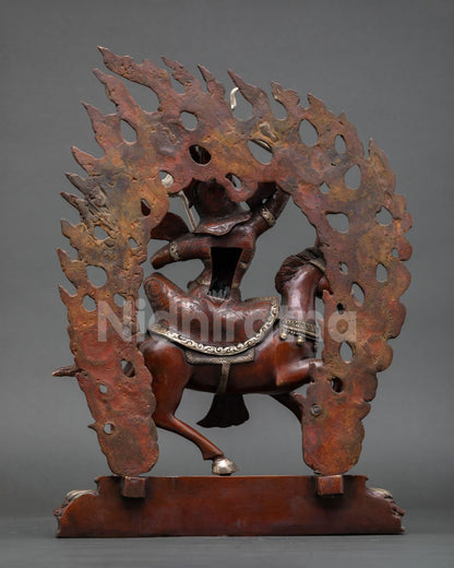 back view of king gesar statue displaying flaming aureole and decorative armor details
