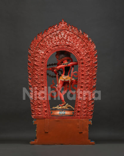 Back view of Kurukulla Statue, blazing halo of flame bordered with vajra and skull motifs