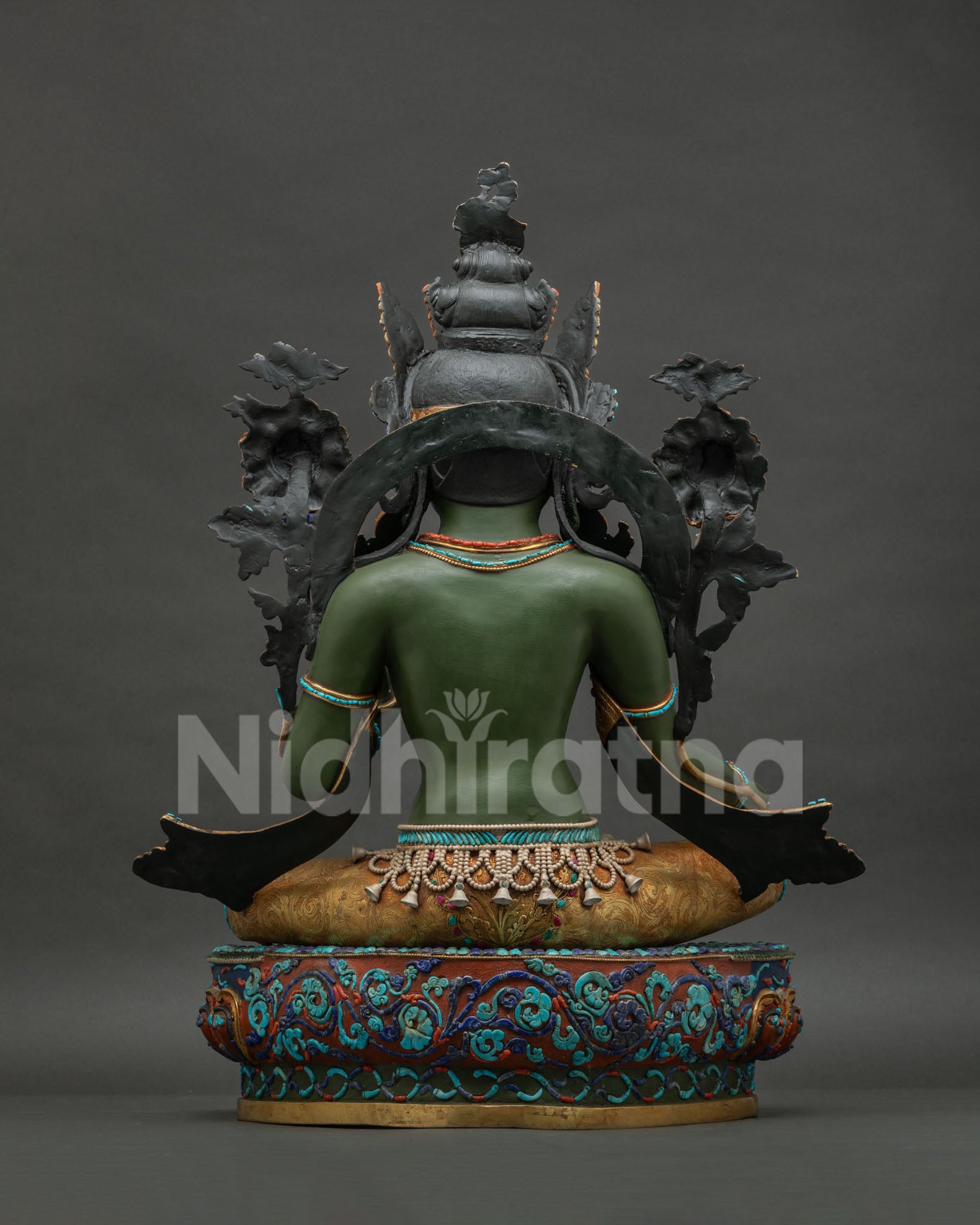 Back view of large copper Green Tara statue highlighting fine repoussé work and authentic Nepali art.