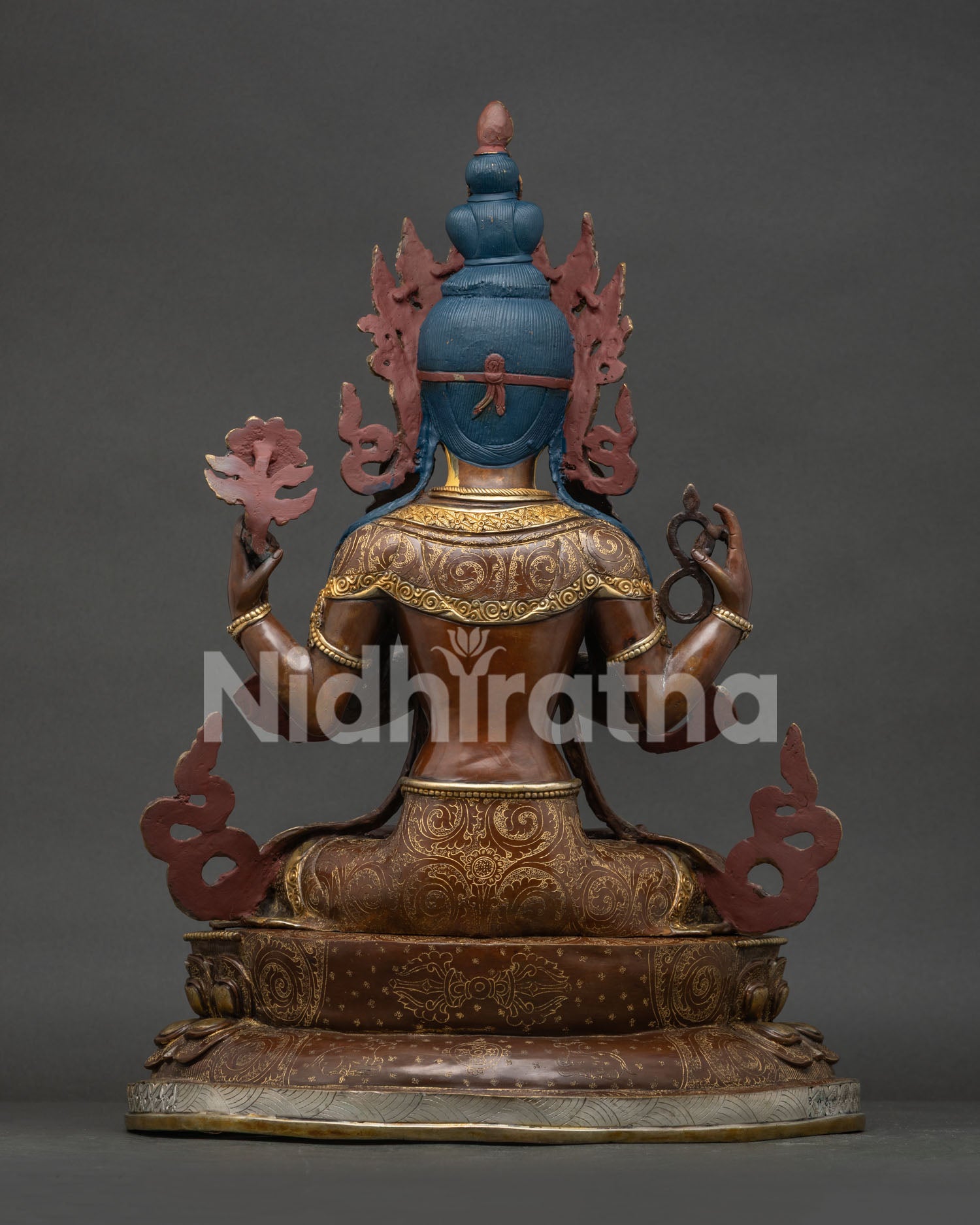Back view of lost-wax cast copper Chenrezig statue showing traditional Newari metalwork and back carvings.