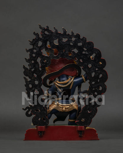 Back view of lost-wax casted Vajrapani sculpture showing the detailed gold-gilded halo.