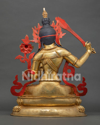 Back view of lotus pedestal with engraved sacred mantras and detailed repoussé Buddhist artwork