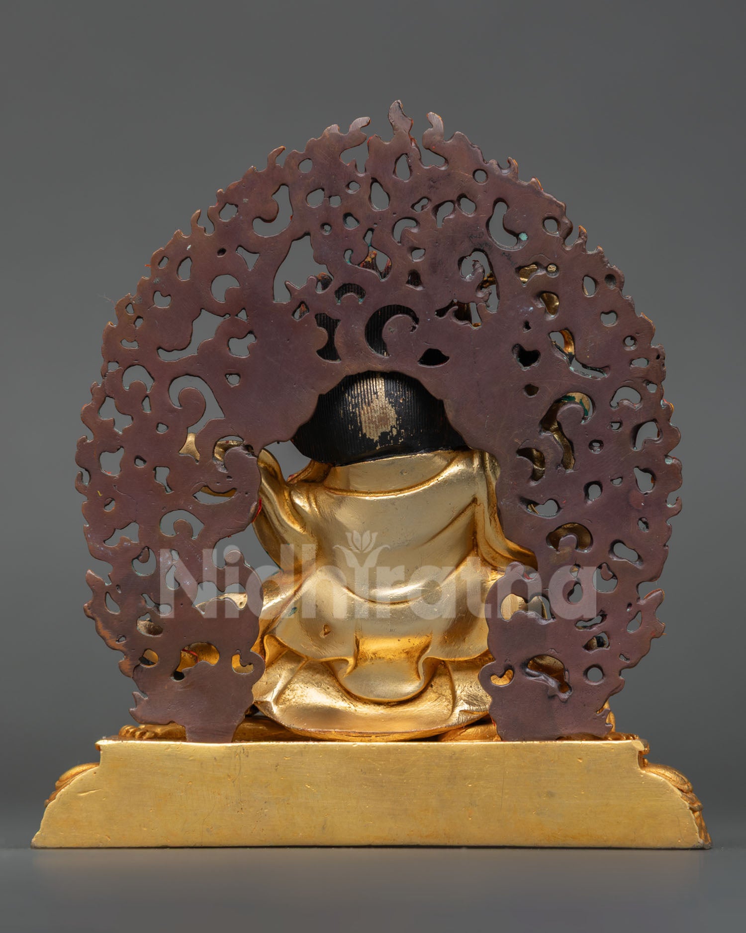 Back view of Mahakala Bernagchen Statue showing detailed cloak design, aureole, and intricate Nepalese metalwork