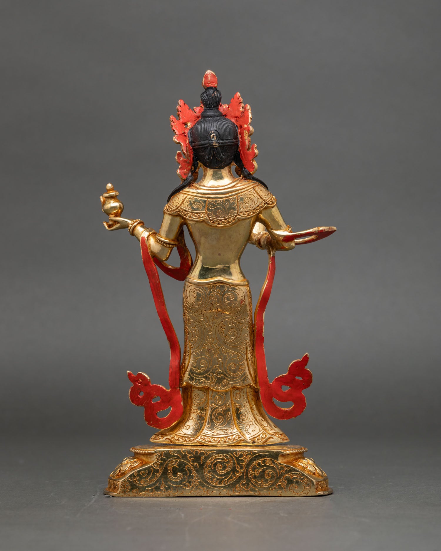 back-view-of-mandarava-statue-intricate-lotus-pedestal-and-flame-motifs