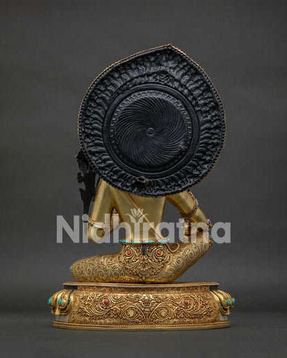 Back view of Manjushri Bodhisattva statue — gold filigree halo and copper alloy construction