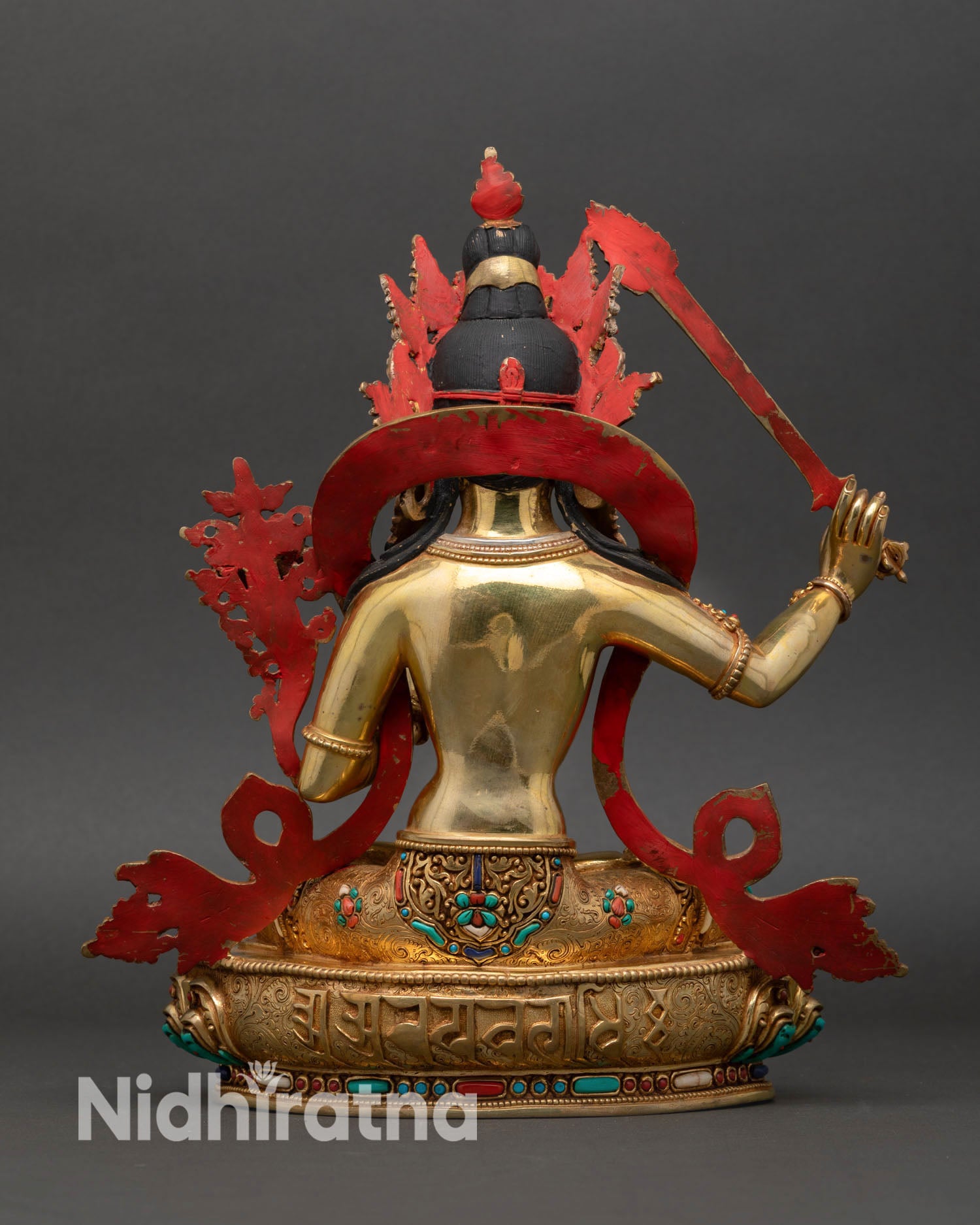 Back view Manjushri statue, detailed flowing robes, lotus base carving, traditional lost wax sculpture