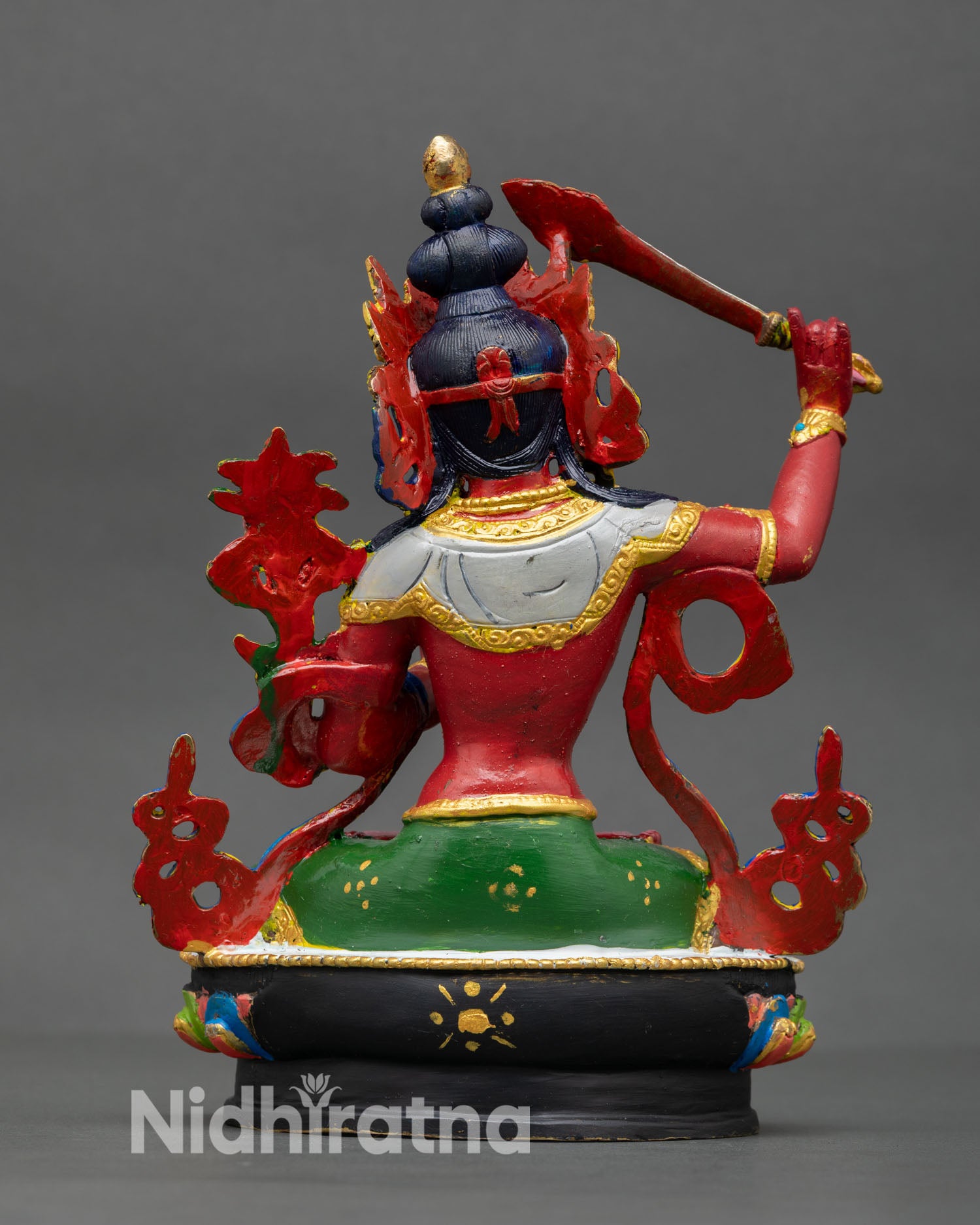 Back view of Manjushri statue highlighting intricate copper detailing hand painted finish and traditional Nepalese Buddhist sculpture artistry.