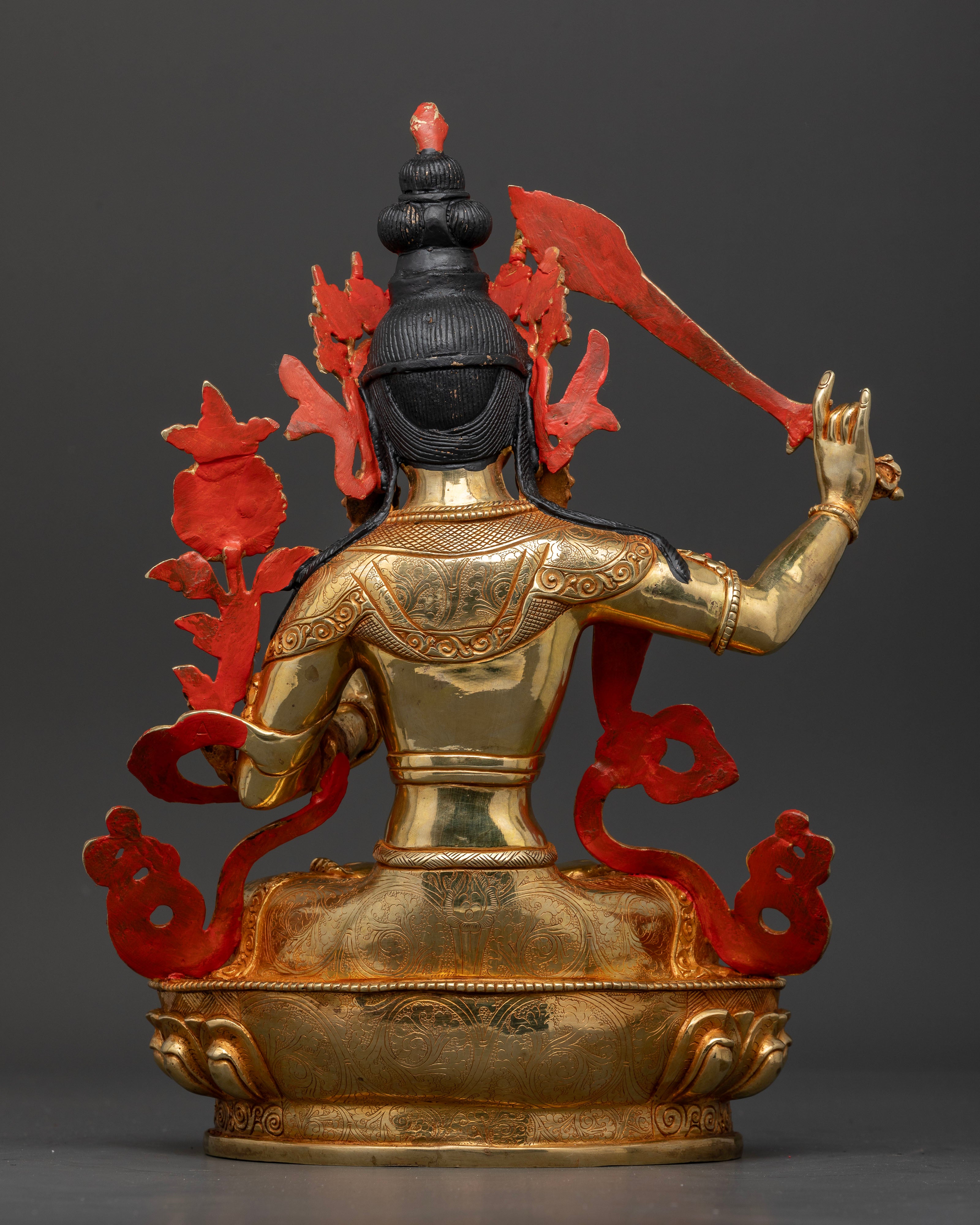Back view of Manjushri Statue showcasing traditional Himalayan artistry
