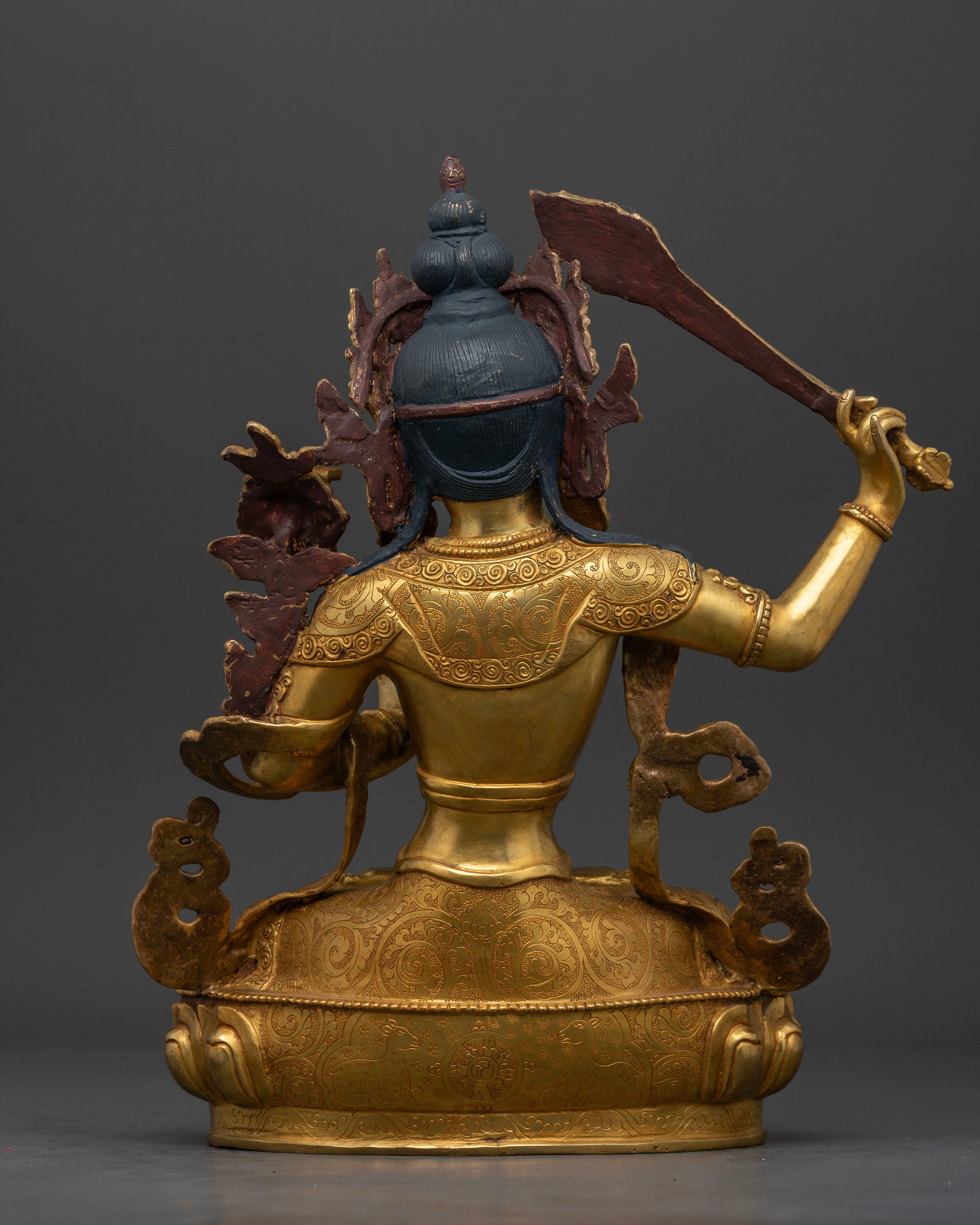 Back view of Manjushri Statue showing copper craftsmanship and ornate details