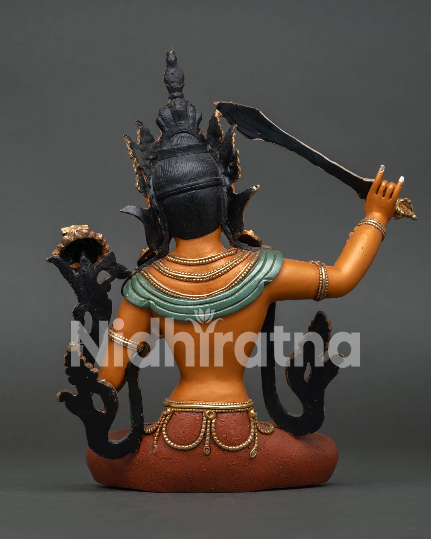 Back view of Manjushri Statue showing crown, sash and lotus base craftsmanship