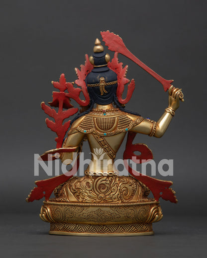 Back view of Manjushri statue showing handcrafted copper work and Himalayan detailing
