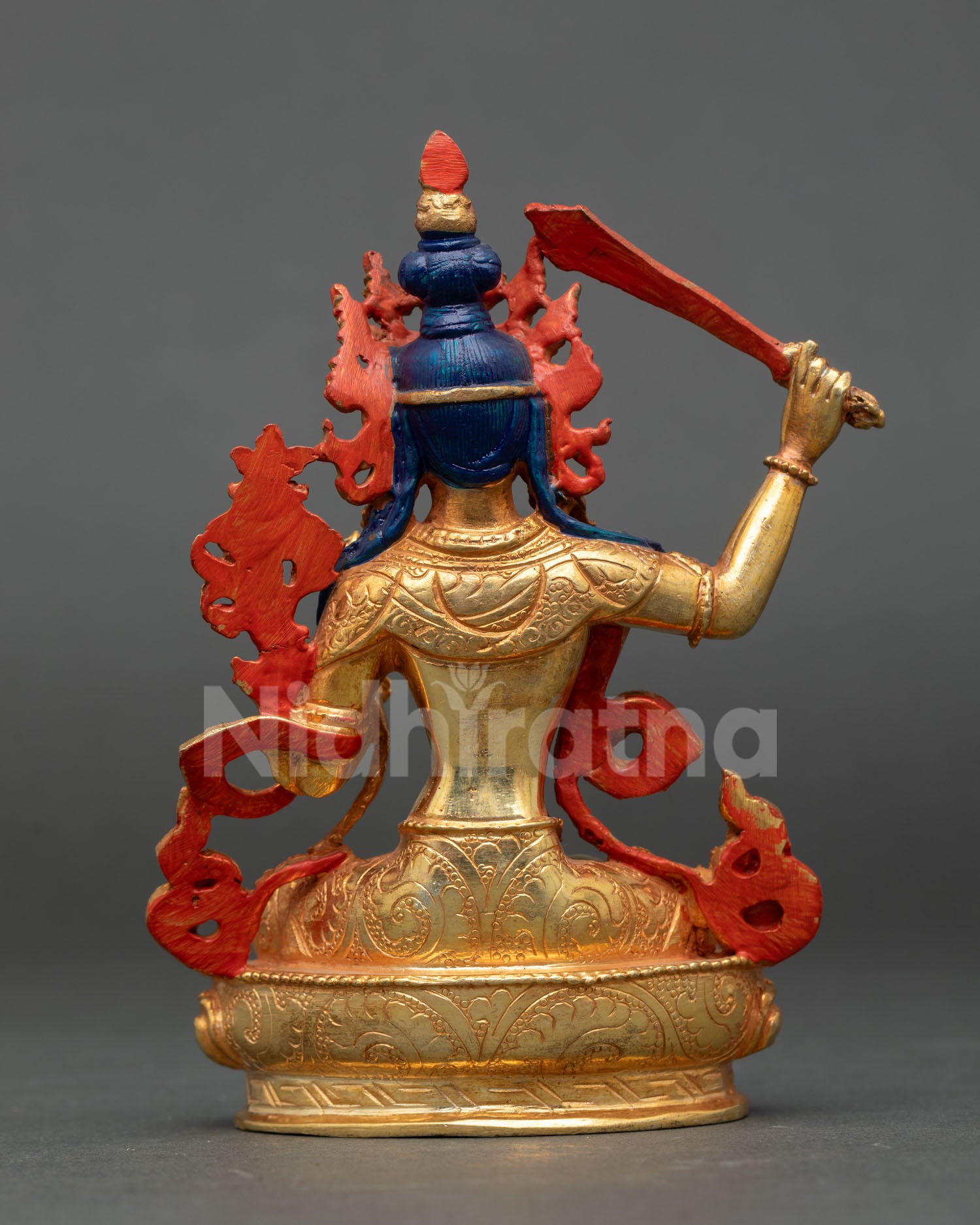 back view of manjushri statue showing intricate nepalese craftsmanship