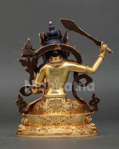 Back view of Manjushri statue showing robe and lotus throne details