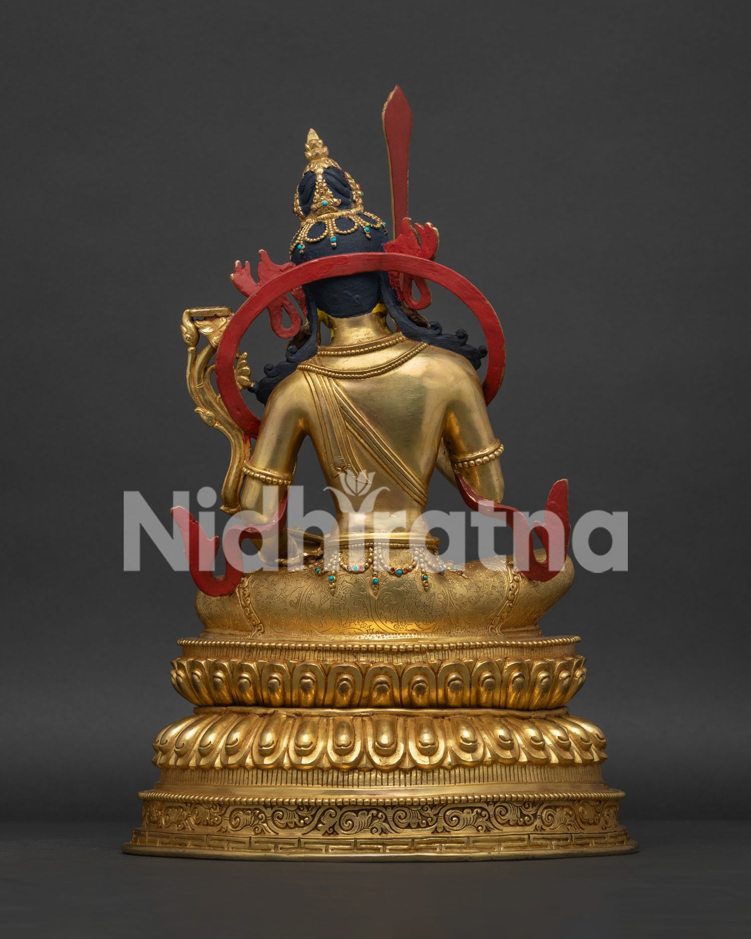 Back view of Manjushri Statue with ornate halo and fine Tibetan metalwork craftsmanship