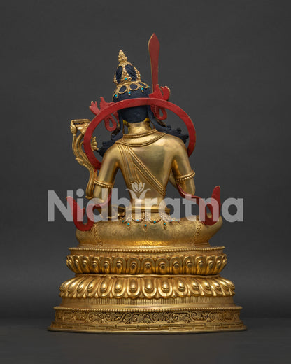 Back view of Manjushri Statue with ornate halo and fine Tibetan metalwork craftsmanship