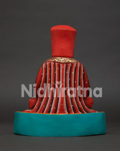 Back view of Marpa Lotsawa statue showing hand-carved robes, handcrafted copper art from Nepal