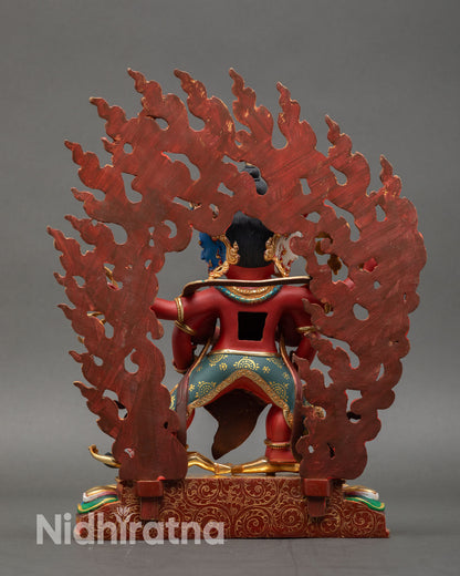 Back view of Marpo Red Dzambhala statue handcrafted copper gold gilded Himalayan artisan sculpture