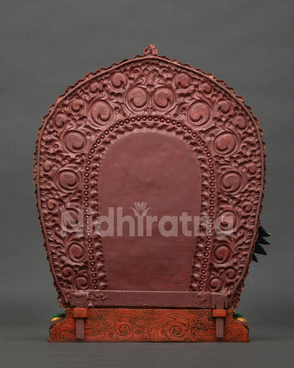 Back view of Namtoshe statue showing detailed flaming halo and Himalayan craftsmanship