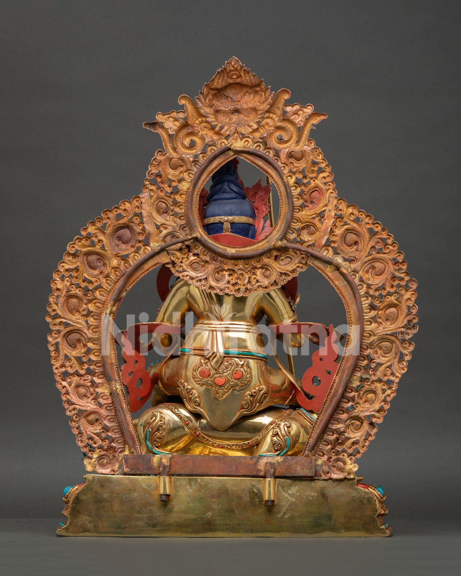 Back view of Namtoshe Statue showing engraved halo and Newari metalwork