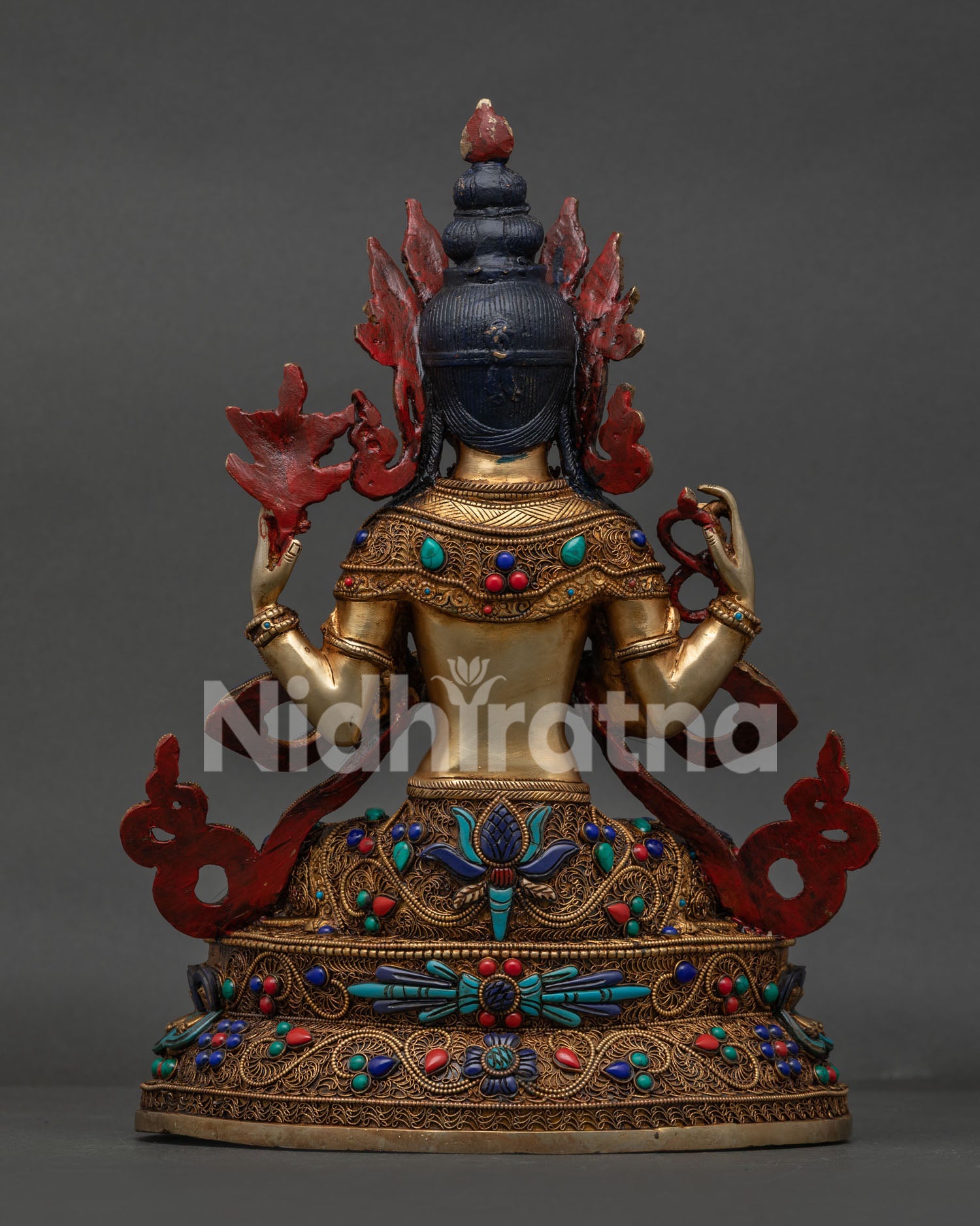 Back view of Nepalese Chenrezig statue with copper, gold-gilded and intricate filigree artwork