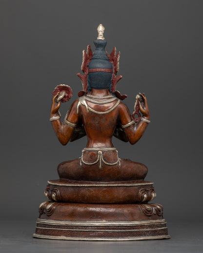 Back view of Nepalese Chenrezig statue with silver plated finish and intricate Buddhist details