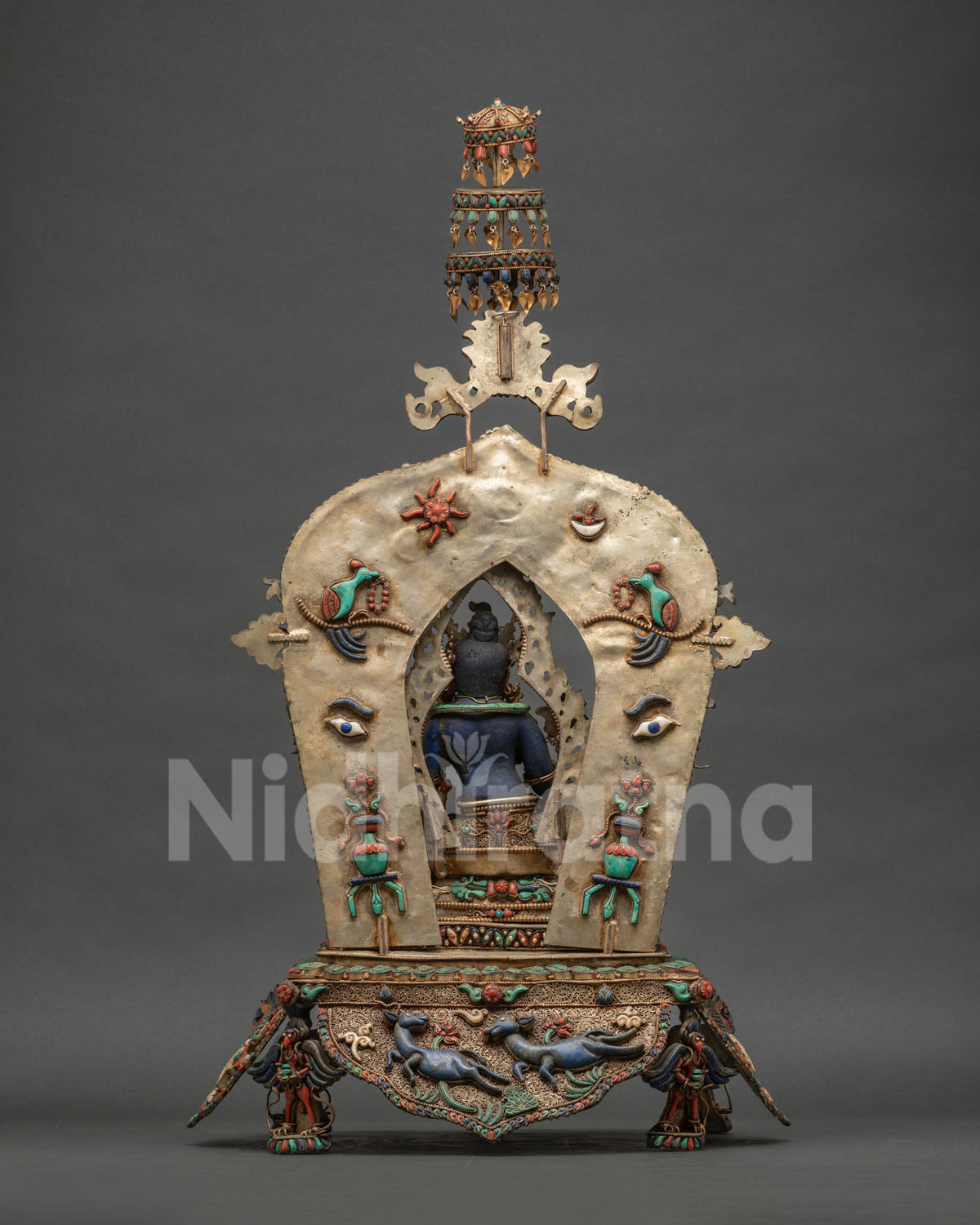 Back view of Nepalese Green Tara statue showing copper structure and triple tier parasol