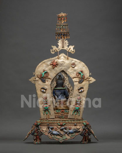 Back view of Nepalese Green Tara statue showing copper structure and triple tier parasol
