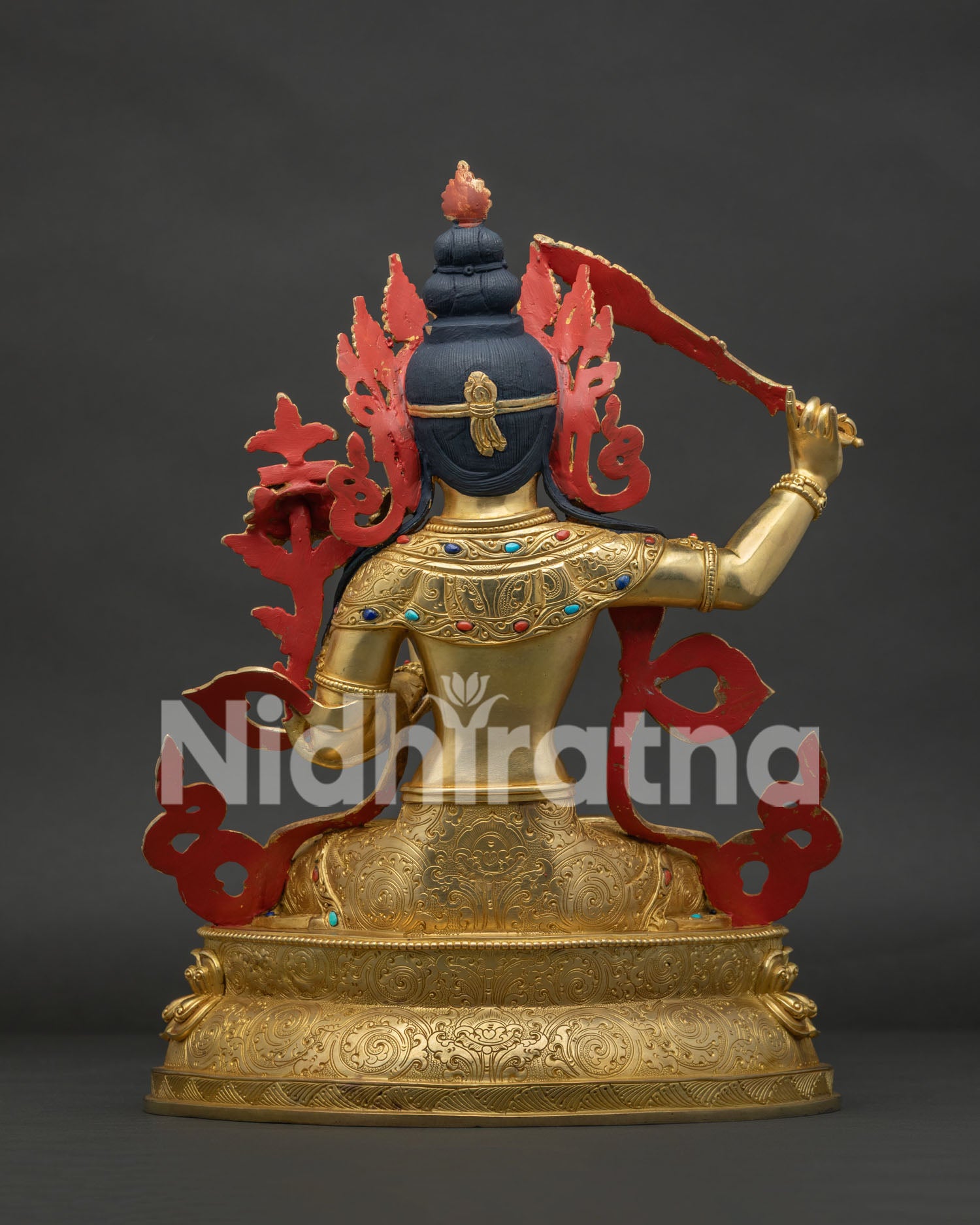 Back view of Nepalese Manjushri copper statue with traditional lost wax craftsmanship