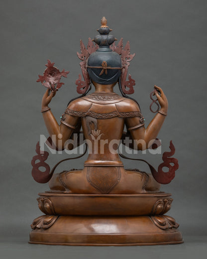Back view of oxidized copper Chenrezig statue showing hair and spine detail