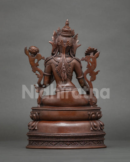 Back view of oxidized copper Green Tara statue with detailed ornate backrest