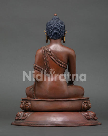 back view of oxidized copper shakyamuni buddha statue with lotus base