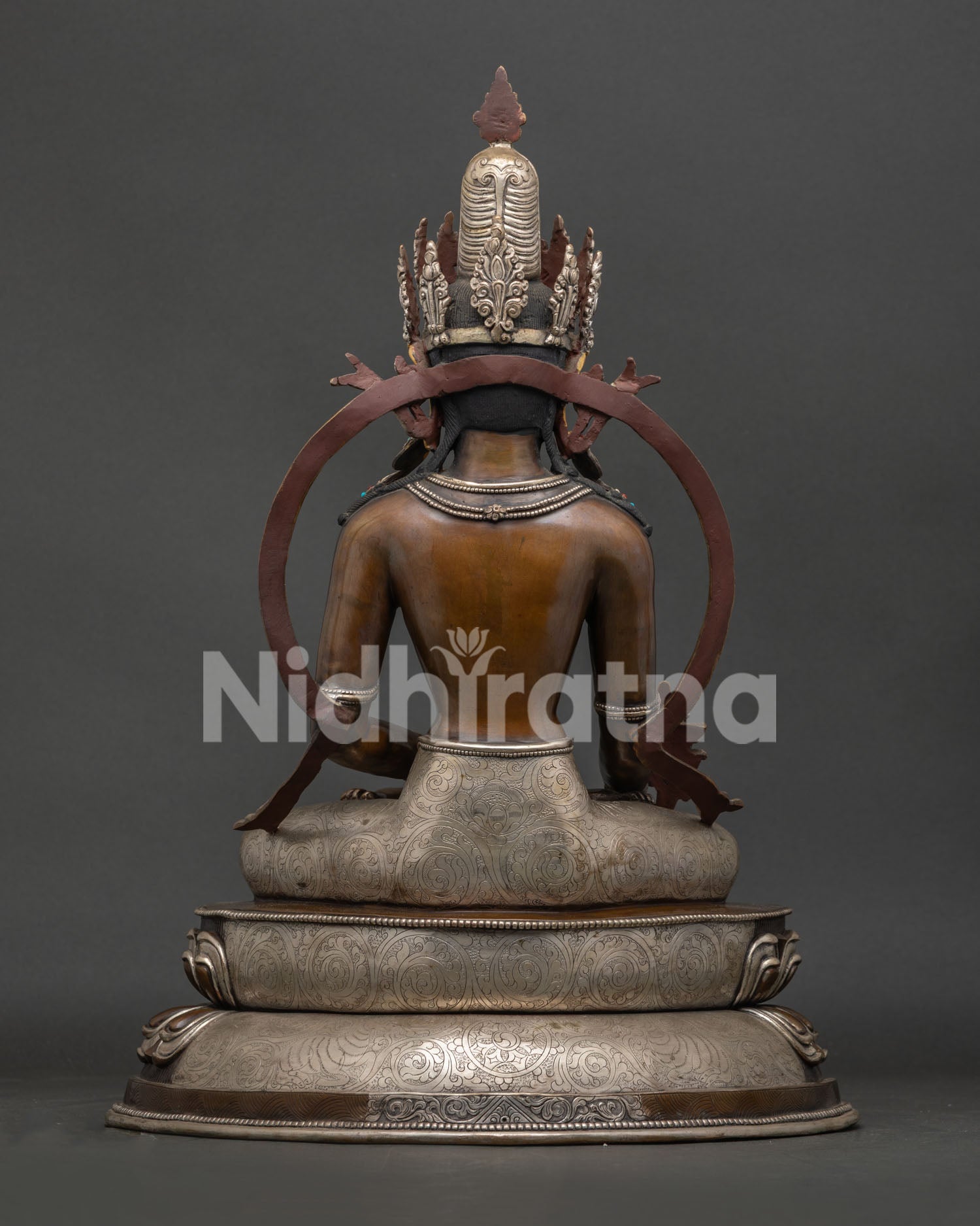 Back view of Oxidized Medicine Buddha Statue with detailed silver plated craftsmanship