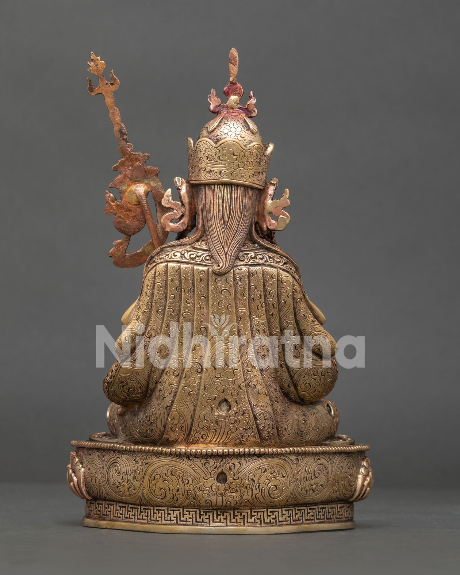 Back view of pure copper Tsokye Dorje statue showing lotus base and robe detailing